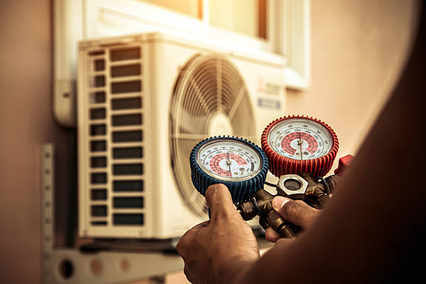 Professional Air Conditioning Service technician working in Cedar Knolls, NJ